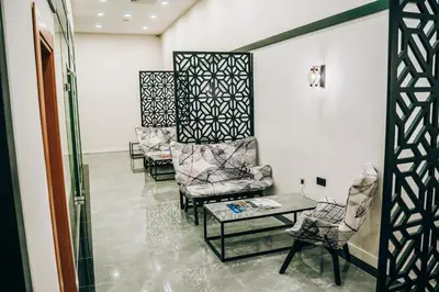 a waiting room with chairs and a table at Roof 264 Hotel & Suites in Sakarya