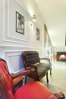 a living room with a couch and a chair at The Independent Hotel Taksim in Istanbul