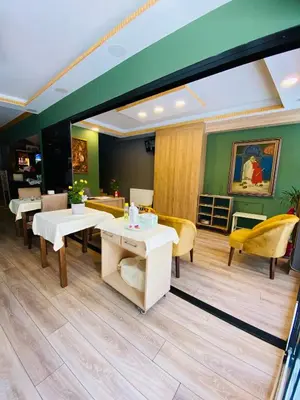 a restaurant with white tables and yellow chairs at Golden Sail Hotel Old City in Istanbul