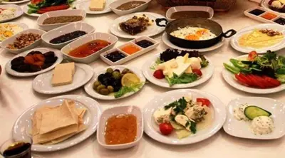 a table with many plates of food on it at Golden Sail Hotel Old City in Istanbul