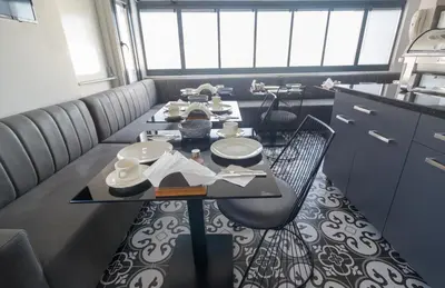 a dining room with a table and chairs at Mardia Hotel in Istanbul