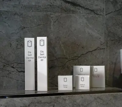 a shelf with several white boxes on it at Class Hotel Bosphorus With Jacuzzi in Istanbul