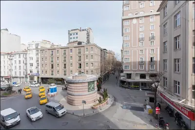 a busy city street with cars and buildings at Blue Apartment in Istanbul