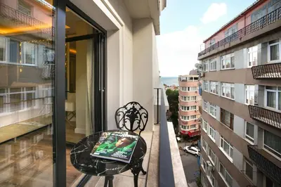 a balcony with a table and a view of a building at Great Fortune Design Hotel & Spa in Istanbul
