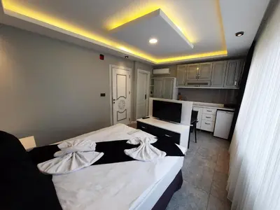 a bedroom with a bed with two pillows on it at Ararat Apart in Istanbul