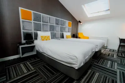 a bedroom with a large bed in a room at Continent Luxury Suites Sakarya in Sakarya