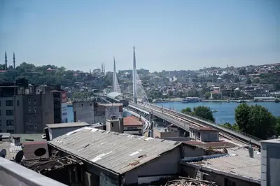 a bridge over a river with a train on it at Galapera Hotel in Istanbul