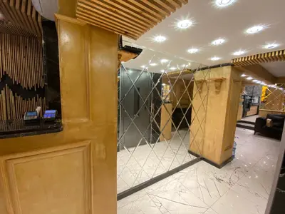 a lobby with a bar with a glass wall at Siesta Premium Hotel in Istanbul