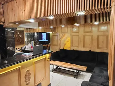 a room with a couch and a desk with a laptop at Siesta Premium Hotel in Istanbul