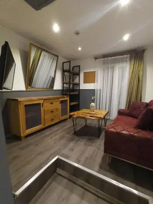 a living room with a couch and a table at Siesta Premium Hotel in Istanbul