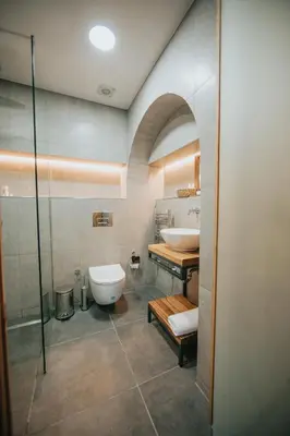 a bathroom with a toilet and a sink and a shower at Büyükada Loc'ada in Adalar