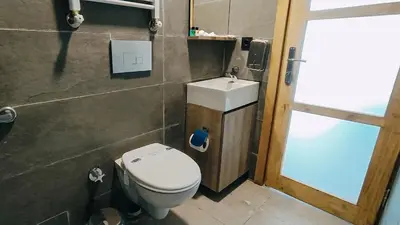 a bathroom with a toilet and a sink at Sahil Kamp İstanbul Hotel in Sile