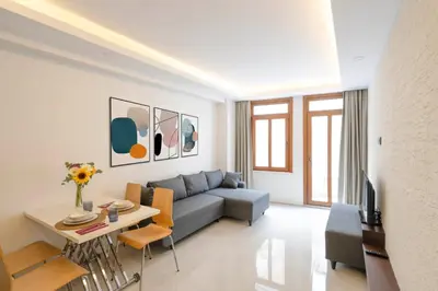 a living room with a couch and a table at Arach Hotel Harbiye in Istanbul