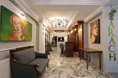 a lobby of a hotel with a painting on the wall at Arach Hotel Harbiye in Istanbul