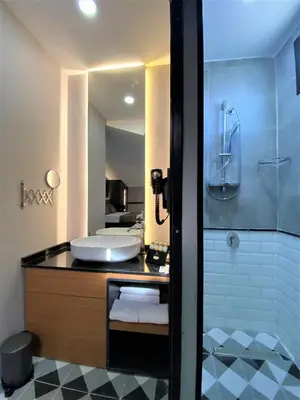 a bathroom with a sink and a shower at Confores Hotel in Istanbul