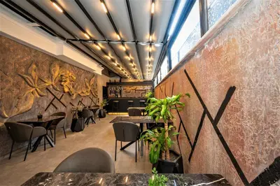 a restaurant with tables and chairs in a room at Confores Hotel in Istanbul