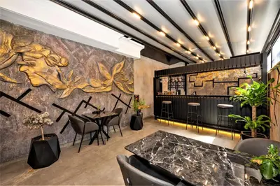 a restaurant with a wall mural and tables and chairs at Confores Hotel in Istanbul