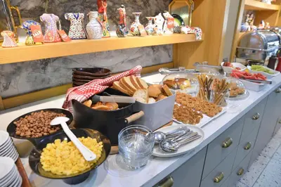 a buffet with many different types of food on a counter at İstport Hotels in Arnavutköy