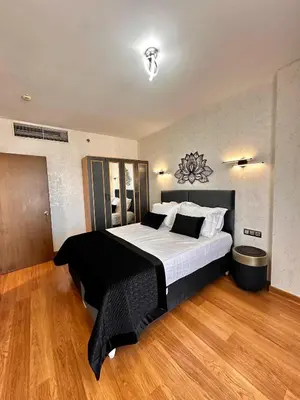 a bedroom with a large bed in a room at SABİHA GOKCEN İSTANBUL HOUSES Airport in Istanbul