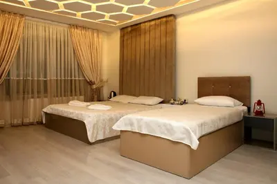 a bedroom with two beds and a window at Blueway Hotel Istanbul Bakırköy City Center in Istanbul