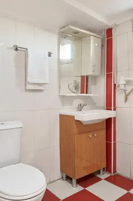 a bathroom with a white toilet and a sink at Central Suites Taksim in Istanbul