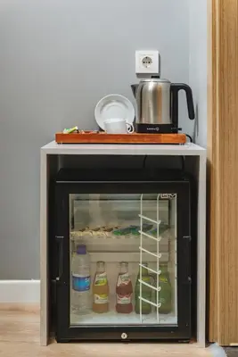 a small refrigerator with food inside of it at Gloria Suites Old City in Istanbul