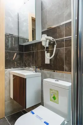a bathroom with a toilet and a sink and a mirror at Gloria Suites Old City in Istanbul