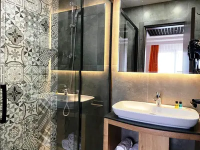 a bathroom with a sink and a shower at MOPE Hotel in Tekirdag