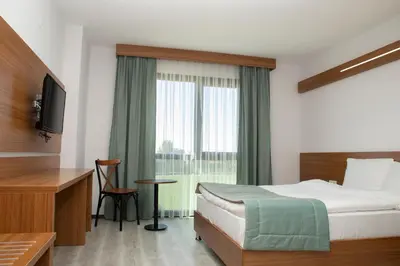 a hotel room with a bed and a television at BUSINESS EXPRESS HOTEL in Tekirdag