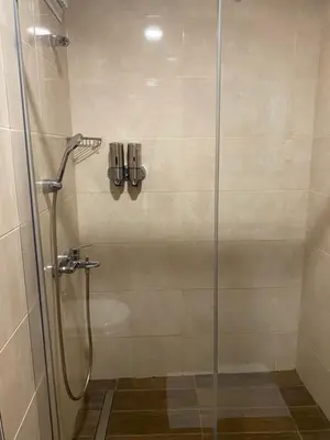 a shower with a glass door in a bathroom at BUSINESS EXPRESS HOTEL in Tekirdag