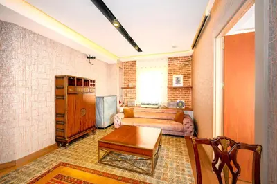 a living room with a couch and a table at O'Pera Okanlı Suites in Istanbul