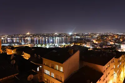 a view of a city at night at O'Pera Okanlı Suites in Istanbul