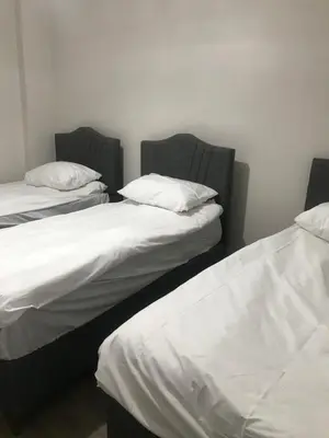 two beds sitting next to each other in a room at Hakan’s apartment in Istanbul