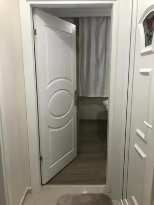 a door that is open to a bathroom with a toilet at Hakan’s apartment in Istanbul