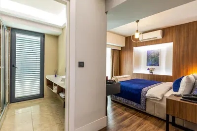 a hotel room with a bed and a bathroom at Union Hotel Port in Istanbul