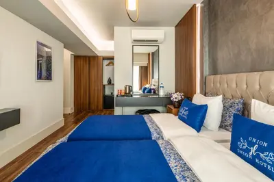 a bedroom with a bed and a couch at Union Hotel Port in Istanbul