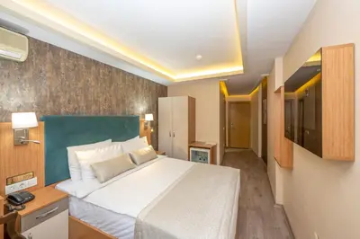 a bedroom with a large bed in a room at The Hotel Devman & Terrace in Istanbul