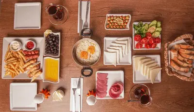 a table with different types of food on plates at Arsisa in Avcılar