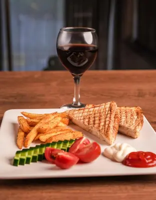 a plate of food with a glass of red wine at Arsisa in Avcılar