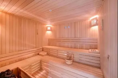 a wooden sauna with a bench in the middle at Cosy Studio Flat -One Room in a new residence near Taksim in Istanbul