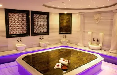 a bathroom with a tub with three toilets in it at GRAND MEDYA HOTEL-OLDTOWN in Istanbul
