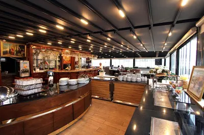 a restaurant kitchen with a counter and a bar at GRAND MEDYA HOTEL-OLDTOWN in Istanbul