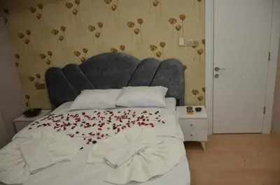 a bedroom with a bed with red hearts on it at Rodion Hotel in Istanbul