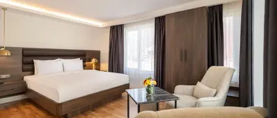 a hotel room with a bed and a chair at The Rooms Nisantasi in Istanbul
