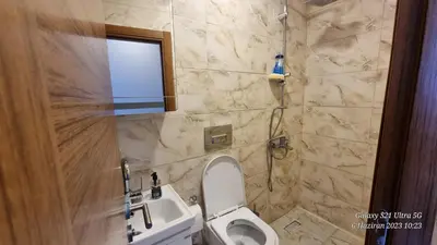 a bathroom with a toilet and a sink and a window at VESTA RESORT BUTİK HOTEL in Istanbul
