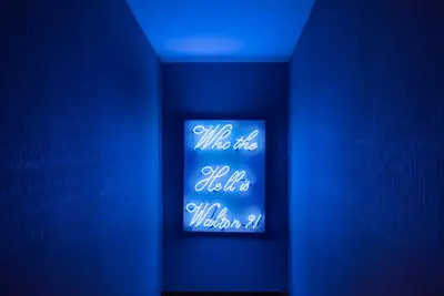 a blue room with a sign that says who wrote so what is wrong at Walton Gardens Pera in Istanbul