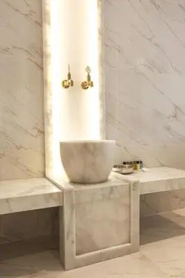 a bathroom with a sink and two benches at Walton Gardens Pera in Istanbul
