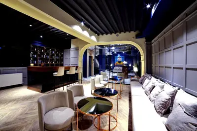 a lobby with couches and chairs and a bar at Walton Gardens Pera in Istanbul