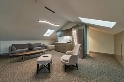 a living room with a couch and a chair at Selini Hotel İstanbul Airport in Istanbul