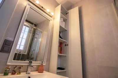 a bathroom with a sink and a mirror at Taksim Roya Apartment -center of the Istanbul in Istanbul